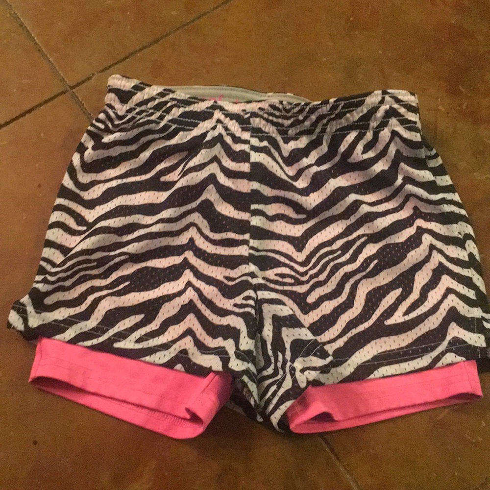 Zebra stripes and bright pink gym shorts!